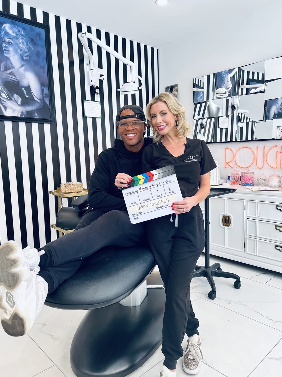 Aaron and Merrill of Rouge & Wright on set with the TV-show slate