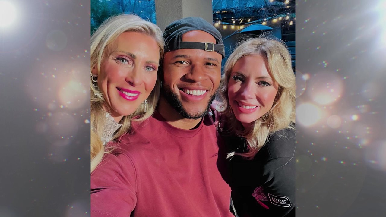 Aaron with Tasha and Merrill of Rouge & Wright, smiling into a selfie on set