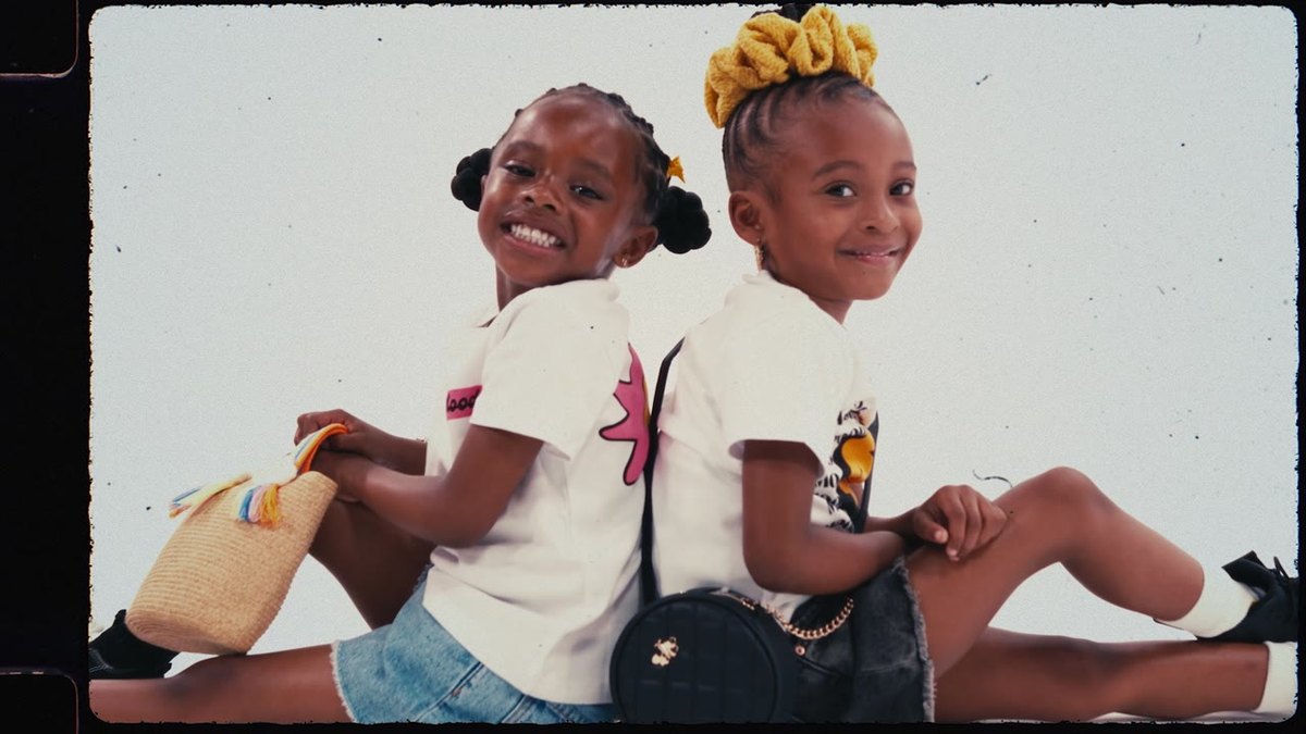 Kids on a playground in Moody Kids apparel